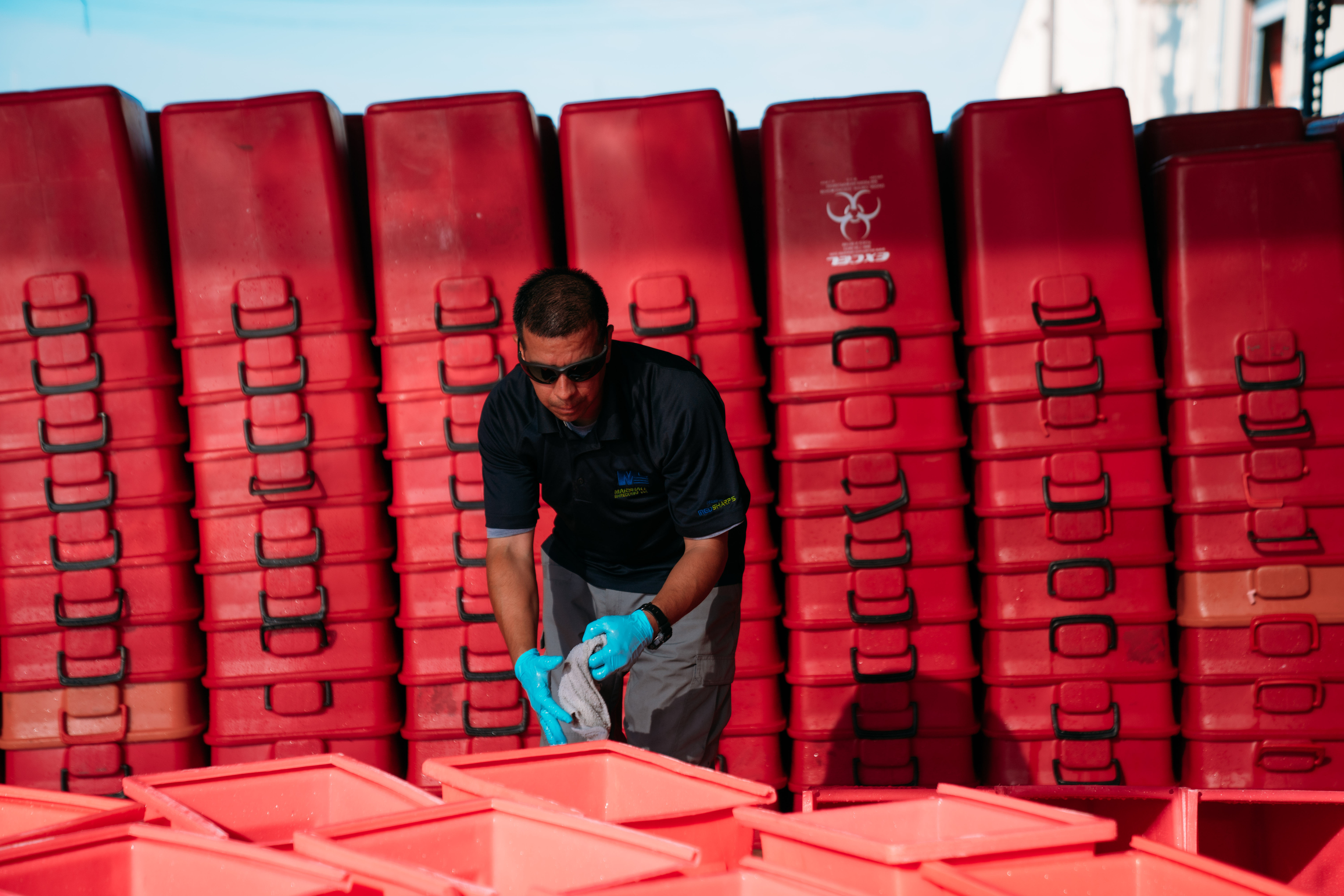 Man working with red tubs