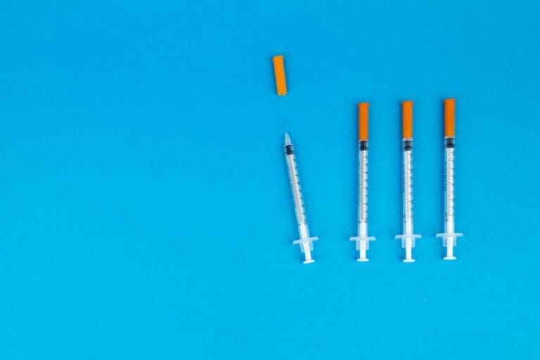 Syringes on Blue Background