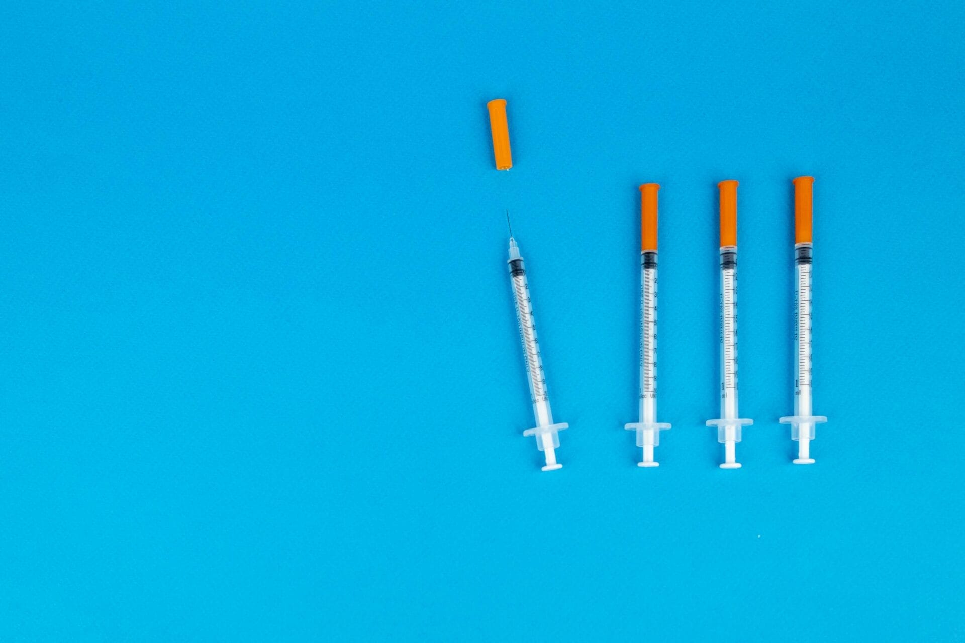 Syringes on Blue Background